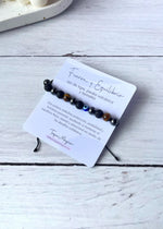 pulsera con ojo de tigre, piedra volcánica y hetamita