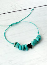 piedra con dije en acero inoxidable